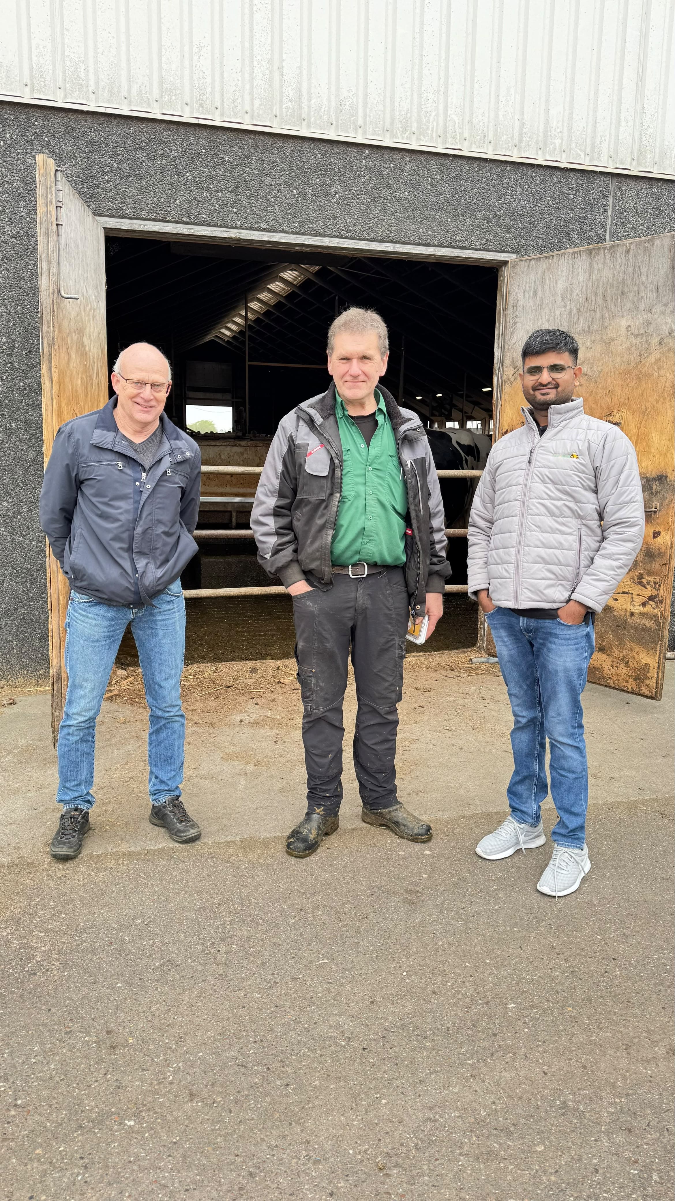 Students working on an international farm — farm-visit-barn-partners
