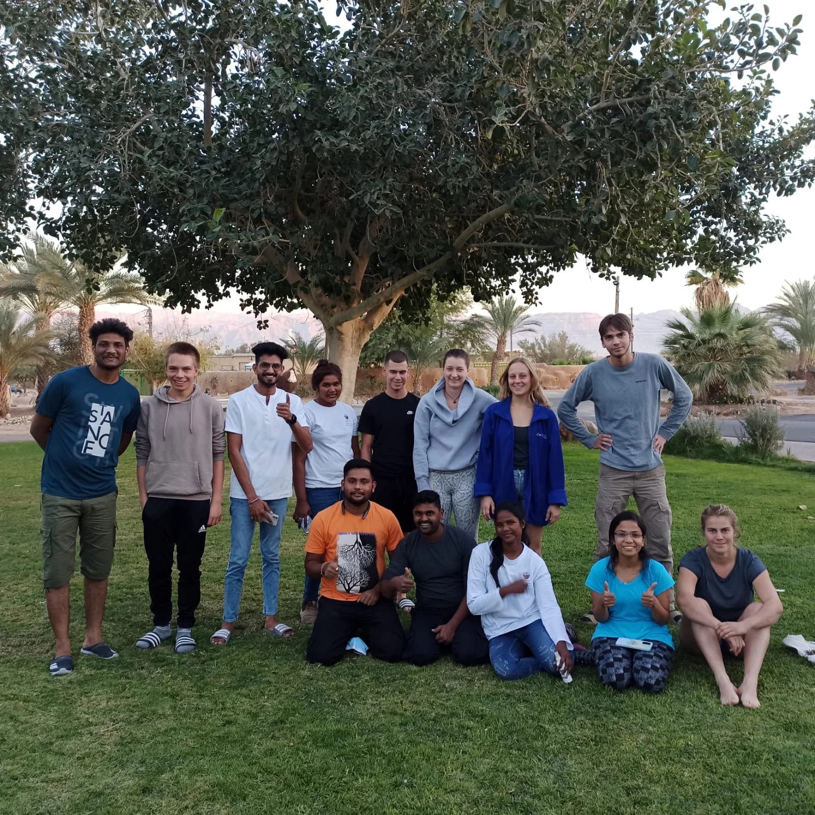 Indian and international students together on campus lawn during a GreenRoot programme abroad